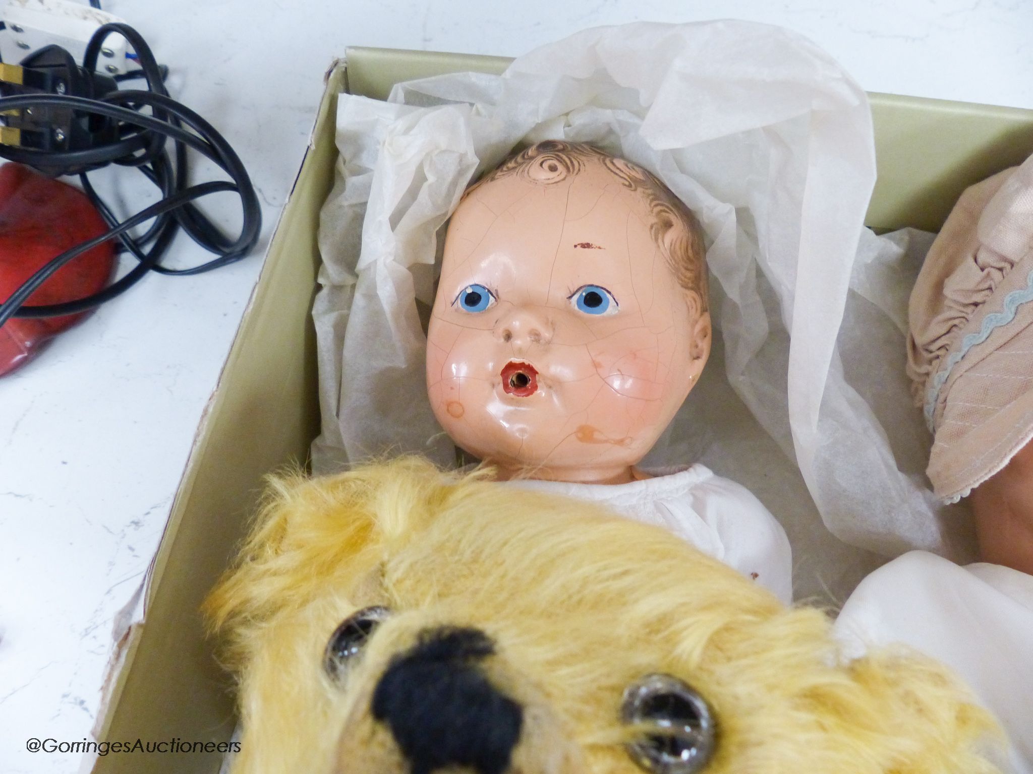 A 1939 Canadian reliable 'Netums' composition doll and a similar 'drunk-wet'doll, a gold mohair unjointed teddy bear and brown terrier